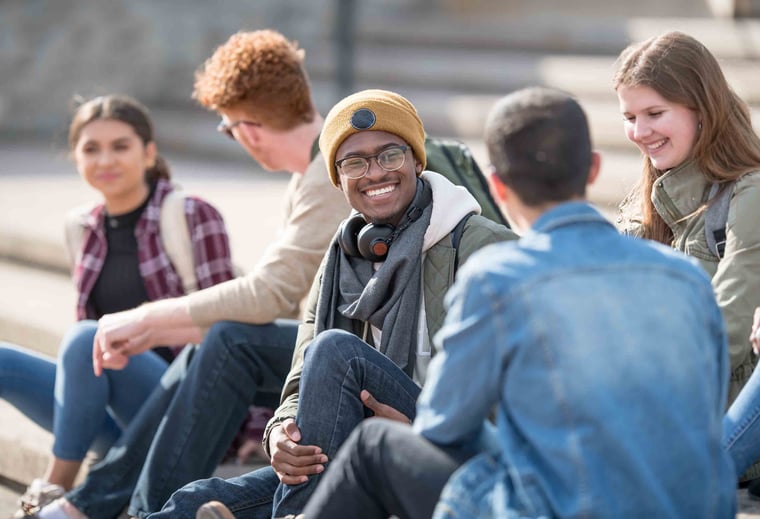 group of friends sitting outside