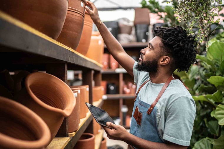 Person looking at plant pots